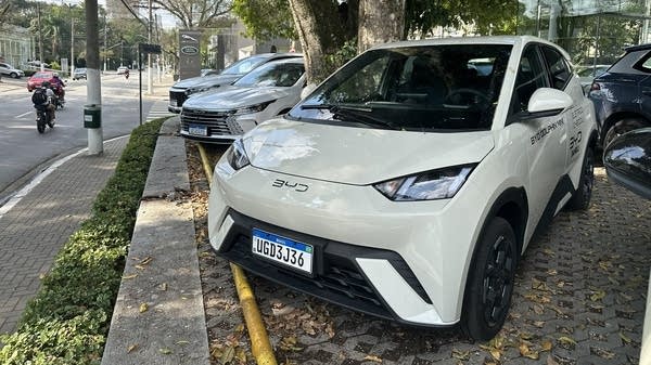 A white BYD Dolphin Mini at a Brazilian BYD Dolphin Mini.
