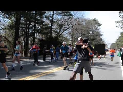 Marathoner can’t run, so he hugs instead