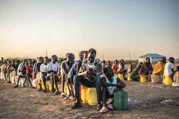 Refugees line up 