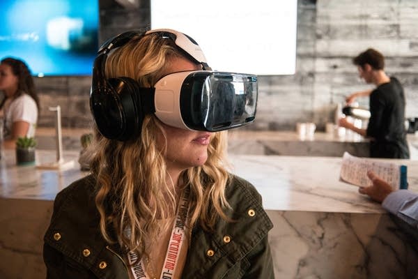 Woman wearing a virtual-reality headset at SXSW 2015.