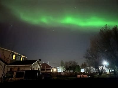 Greens and reds fill the night sky.