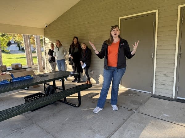 A candidate speaks to a group of volunteers.