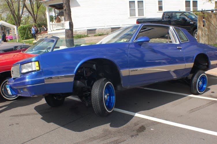 A lowrider sits on three wheels