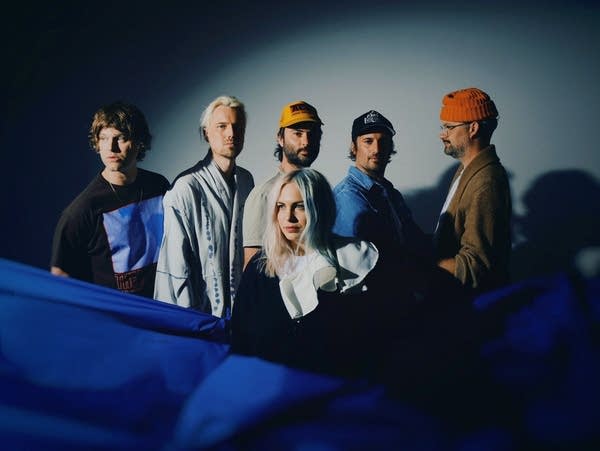 Six people pose for a photo