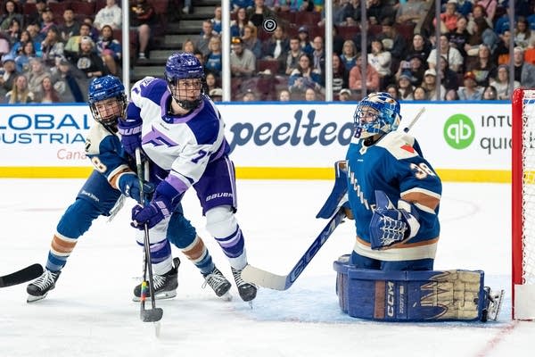 Women play hockey