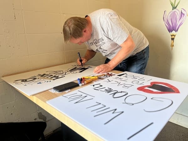 Couple works on poster