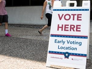 Voters exit the Ramsey County Elections Plato Building.