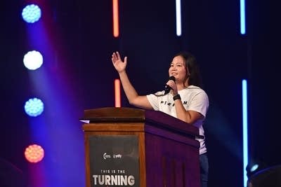 A student stands at a podium
