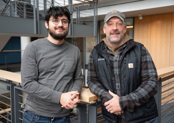two men posing for a portrait