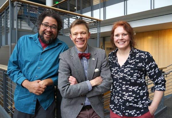 three people pose for a portrait