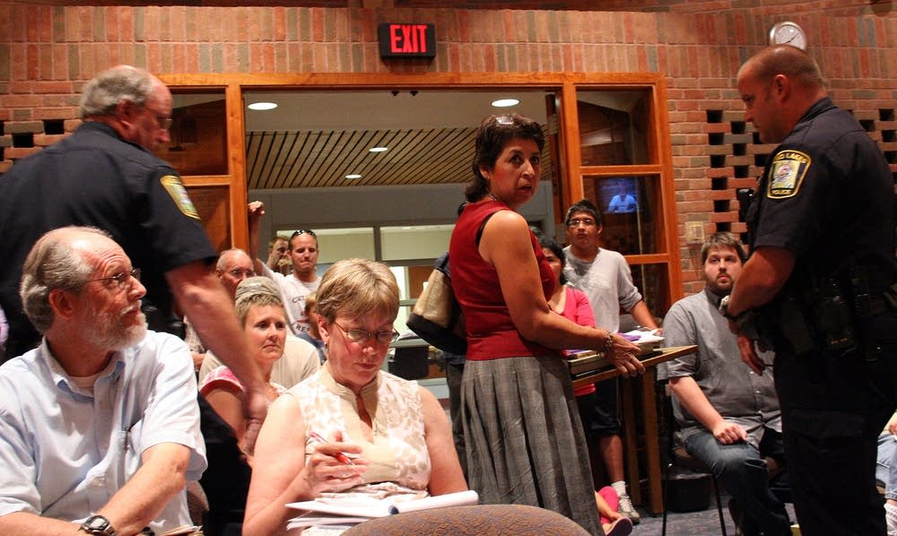 Dora Salazar-Rolfzen escorted out