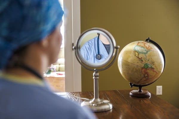 A person is reflected in a mirror