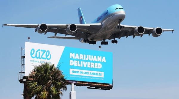 A Los Angeles billboard advertising the marijuana delivery service Eaze.
