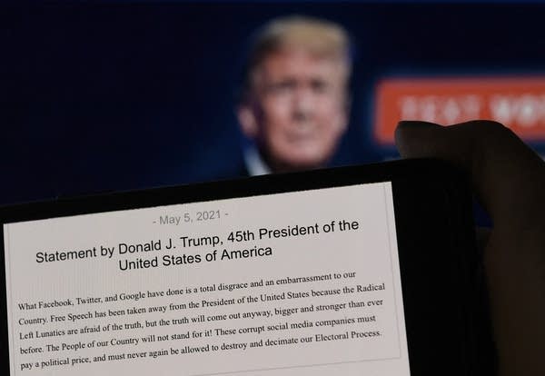 A statement from former President Donald Trump appears on a computer screen.