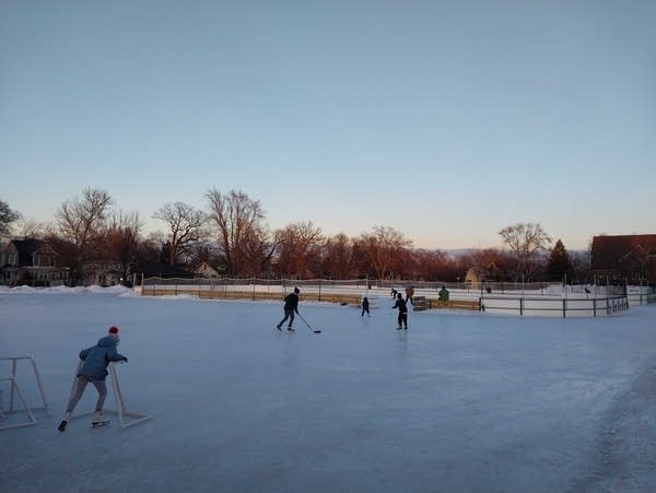 Skaters make the most of the last day of ice at an outdoor rink