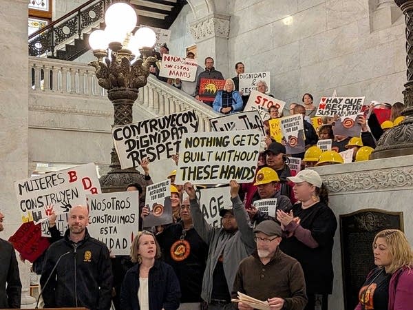 Protesters gather on the steps of Minneapolis City Hall.