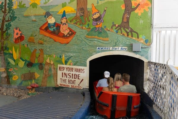 fairgoers riding ye old mill