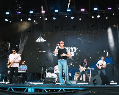 the band yam haus performing on stage