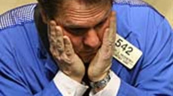 A New York Stock Exchange trader during trading today.