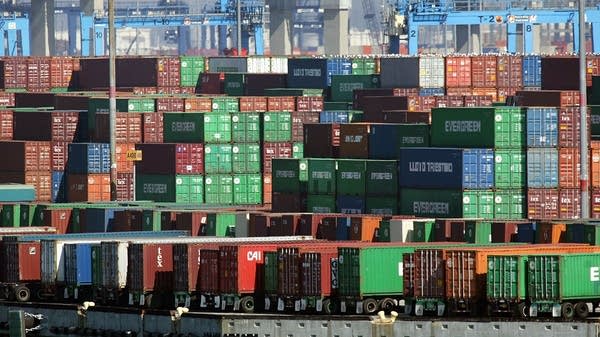 Shipping containers are stacked on docks in the Port of Los Angeles in San Pedro, California.