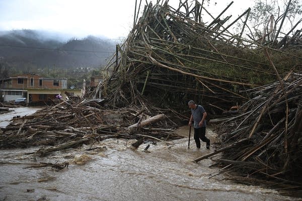 A man walks through a road.