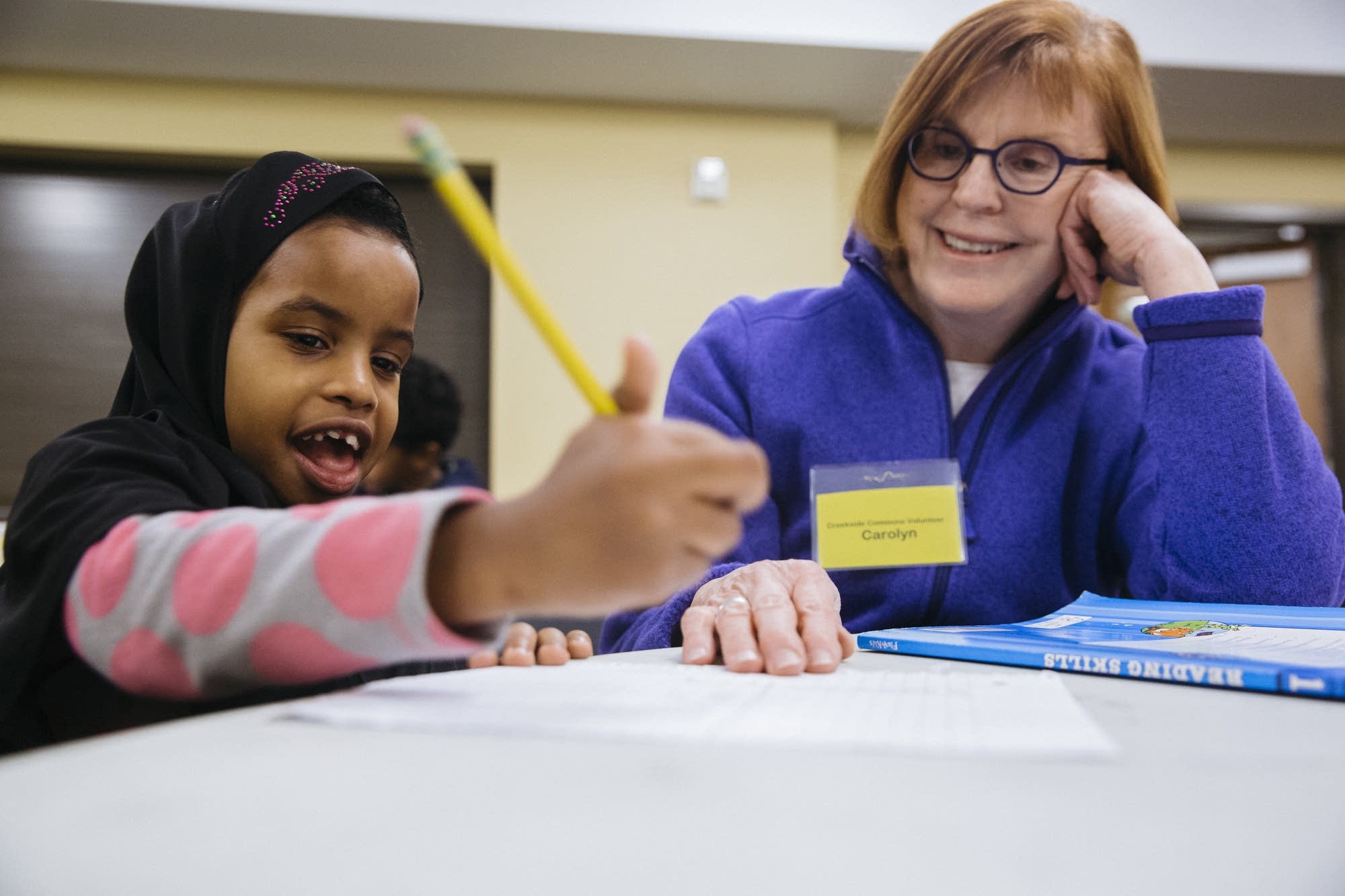 First-grader Nafisa gets homework help.