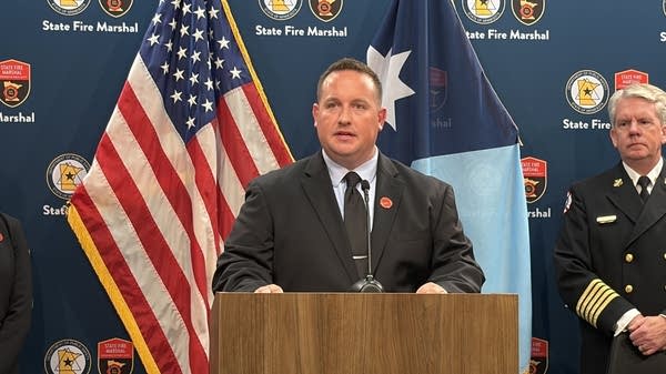 A fire safety official speaks at a podium