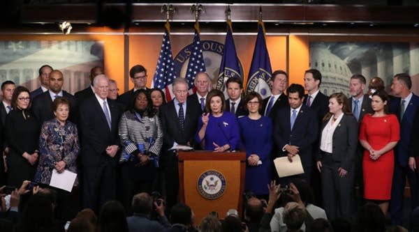 House Speaker Nancy Pelosi (D-CA) is flanked by fellow members during a news conference on the USMCA trade agreement Tuesday in Washington, D.C.