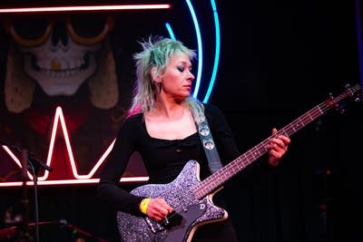 Bass player performing on stage
