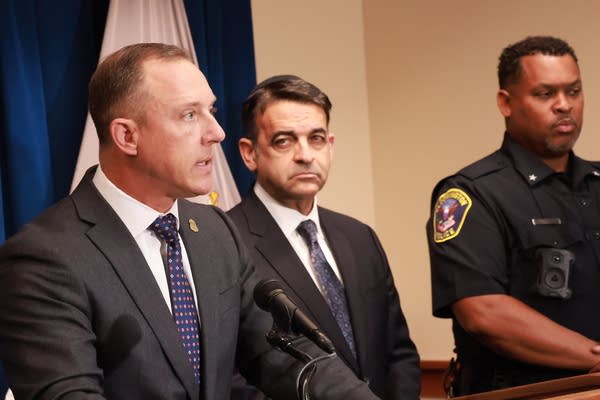 3 men announce charges at presser