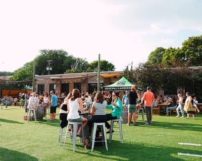 people enjoying live music and a happy hour outdoors