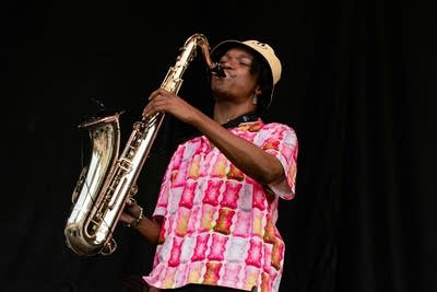 laamar and his band performing on stage