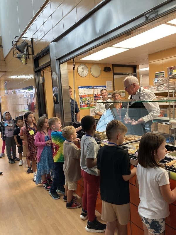 A man serves lunch