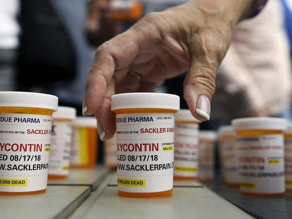 Prescription bottles placed on the sidewalk.