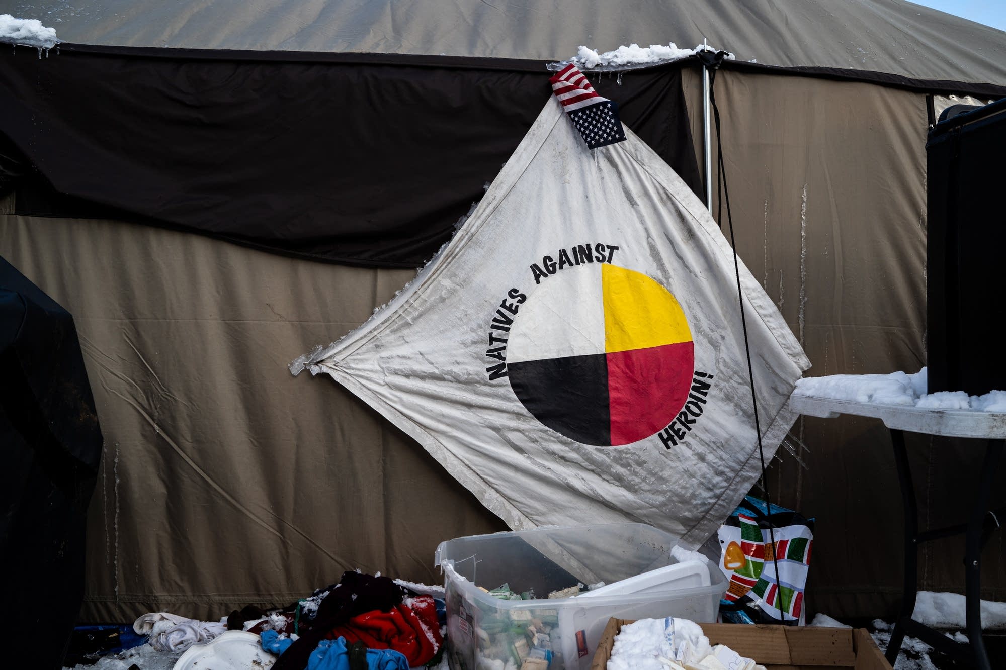 A Natives Against Heroin flags hangs frozen.