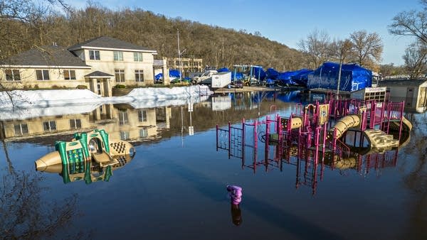 A playground surrounded by water.