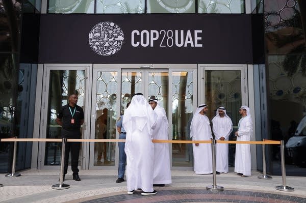 DUBAI, UNITED ARAB EMIRATES - NOVEMBER 29: Men wearing thawbs stand outside a venue at the UNFCCC COP28 Climate Conference the day before its official opening on November 29, 2023 in Dubai, United Arab Emirates. The COP28 is bringing together stakeholders, including international heads of state and other leaders, scientists, environmentalists, indigenous peoples representatives, activists and others to discuss and agree on the implementation of global measures towards mitigating the effects of climate change. 