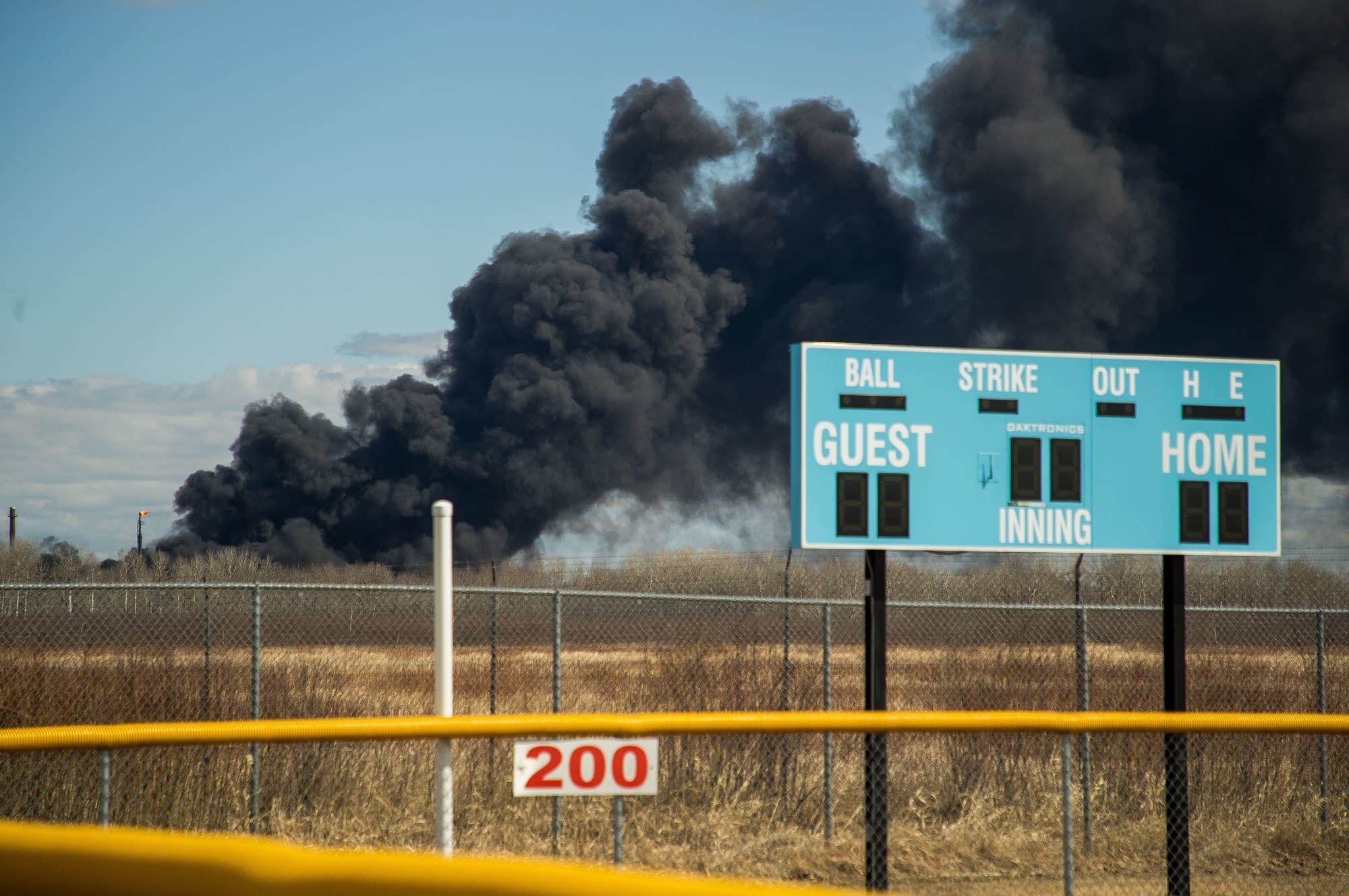 Black smoke rises behind Superior Middle School.