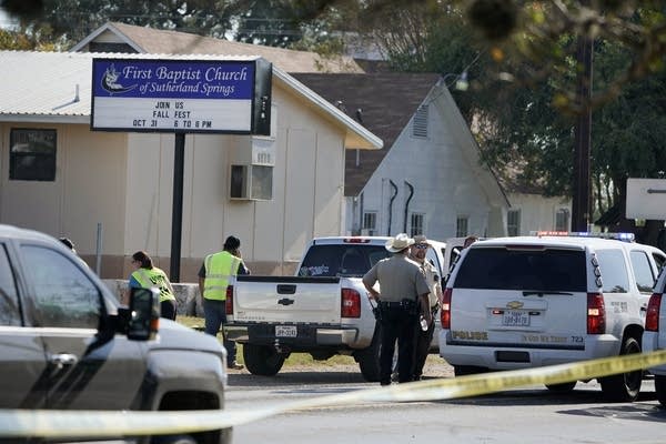 Officers gather in front of the First Baptist Church of Sutherland Springs