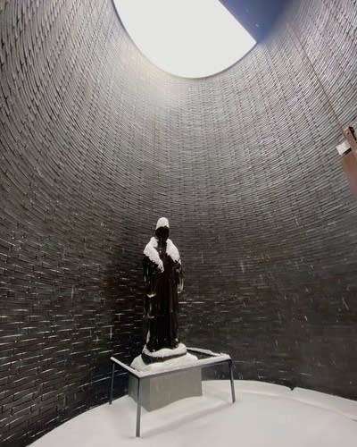 sculpture of a man covered in snow