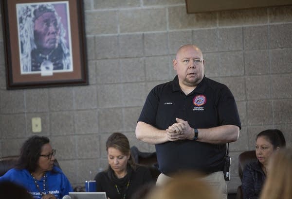 Emergency management coordinator Schyler Martin provides flood updates.