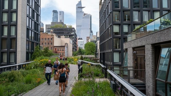 Who wouldn't feel happy soaking up the sun while sipping a cold brew on the High Line?