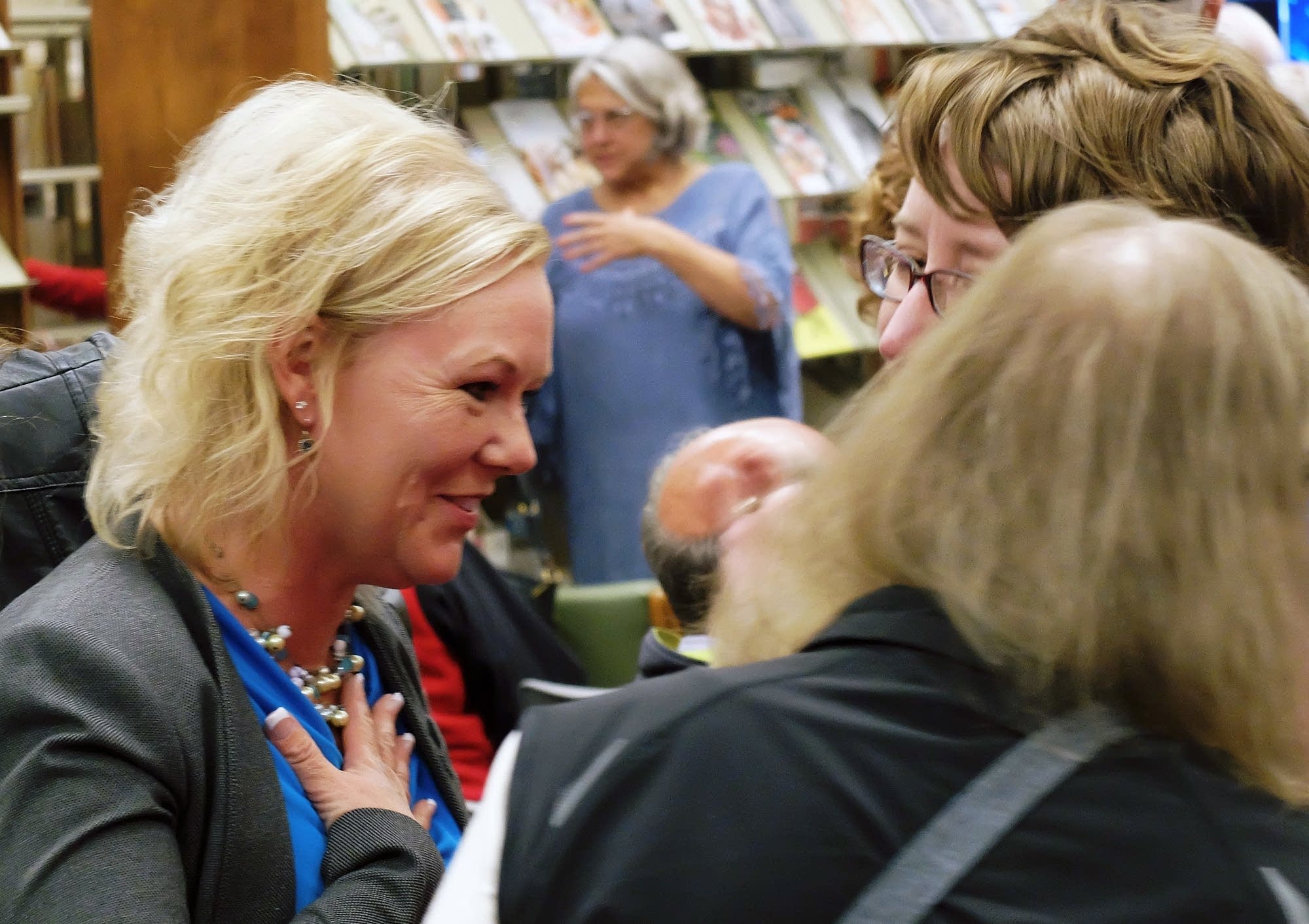 Moorhead mayoral candidate Brenda Elmer talks with local residents.