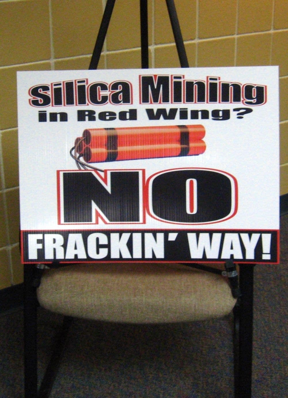 'No frackin' way' sign at meeting at the city libr