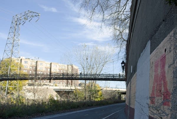 People walk across the 'M' Suspension Bridge. 