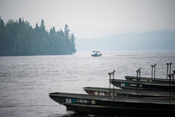 A tow boat driver in the distance 