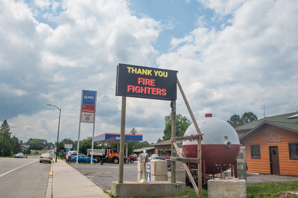 An electronic sign on the side of the road reads, "Thank you fire fighters."