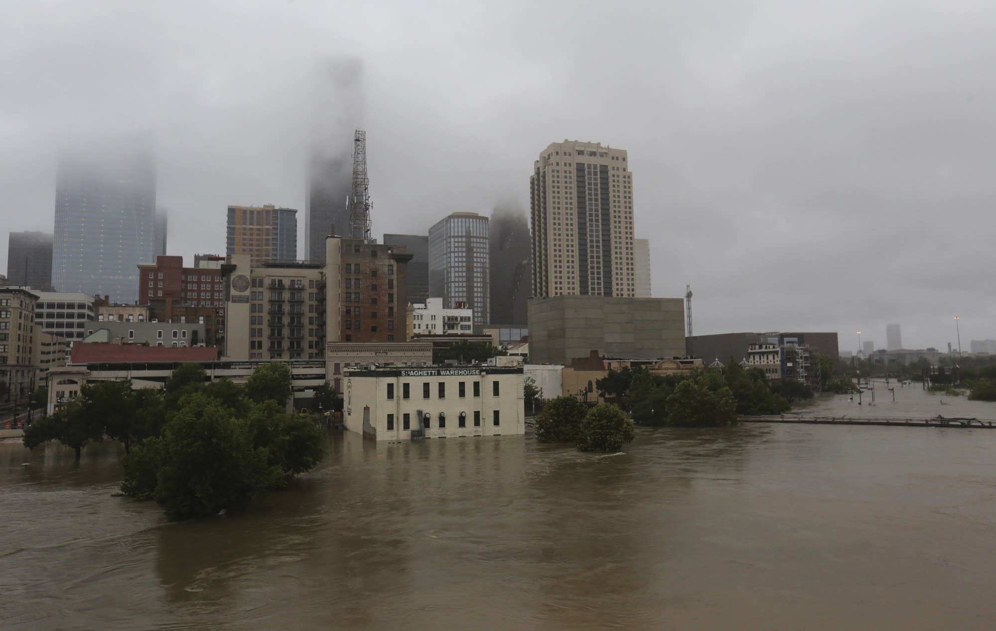 Floodwaters from Tropical Storm Harvey flow in the Buffalo Bayou.