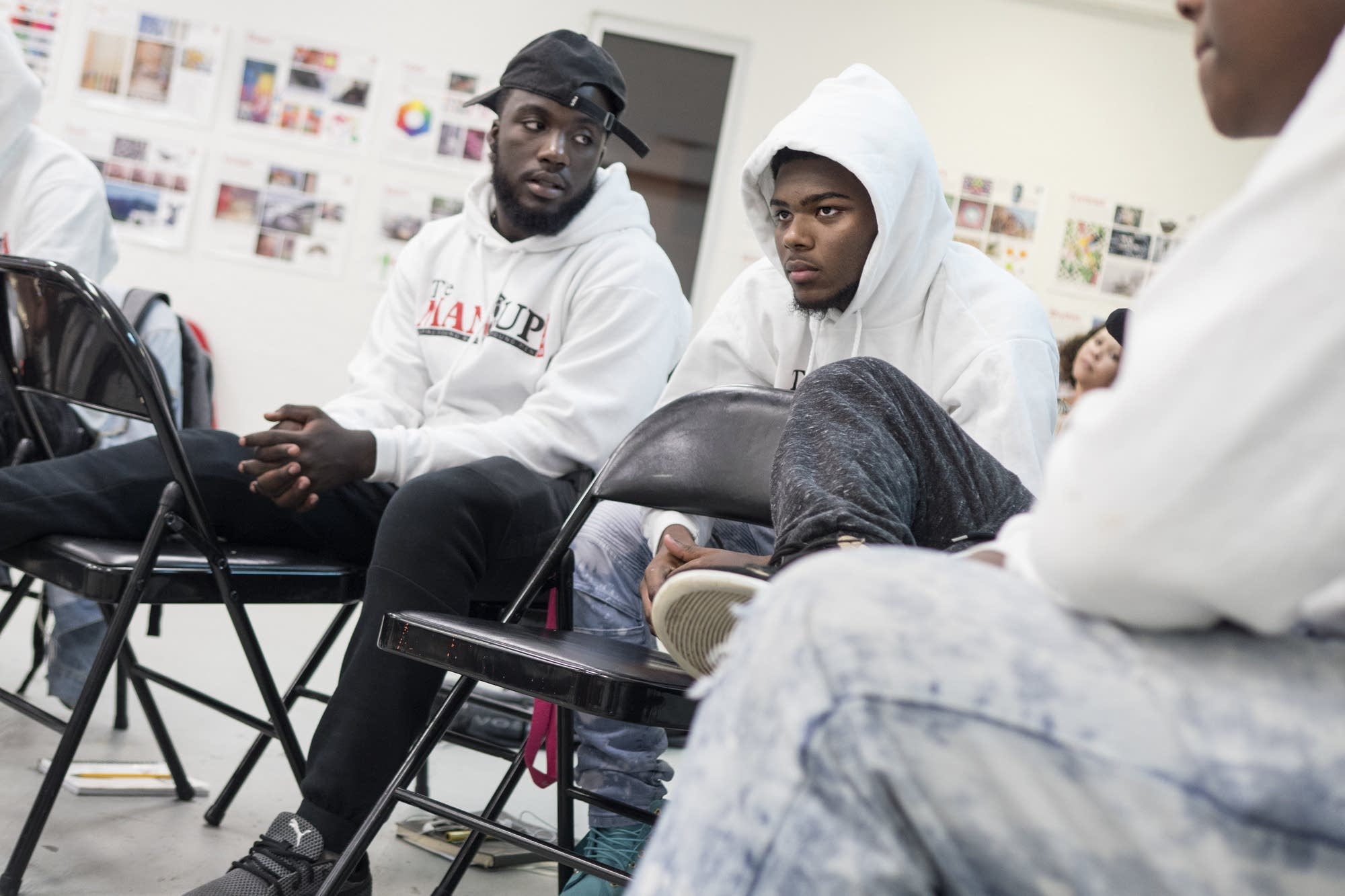 Meek Stalling, 17, left, listens as Keimonte White, 16, shares challenges.