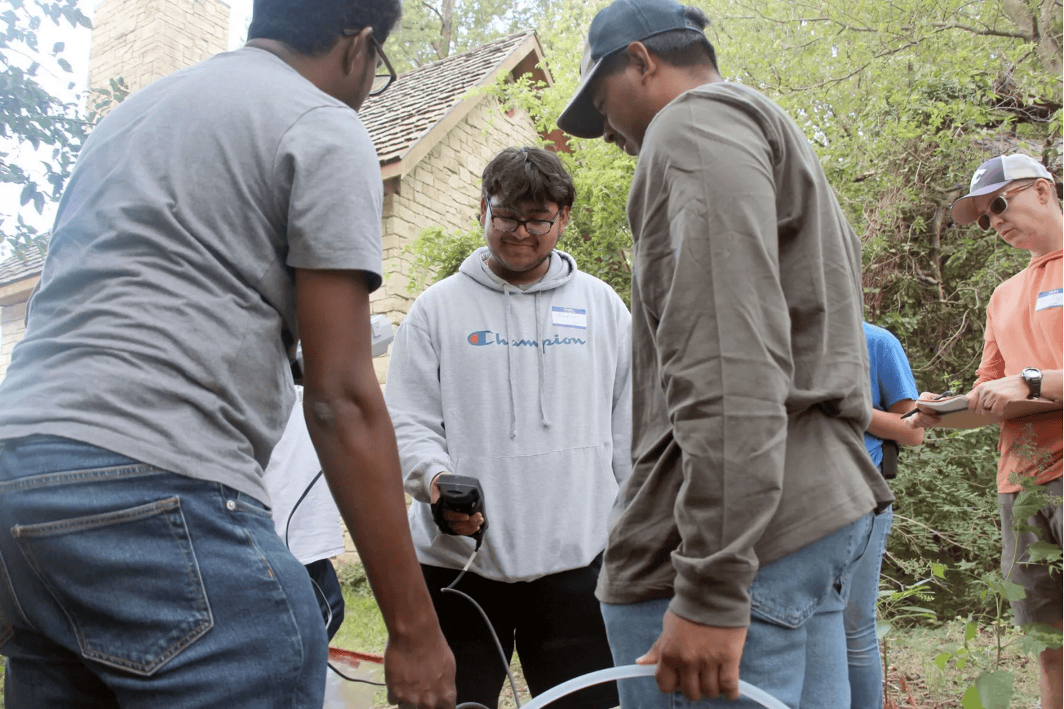 A team sampling a well